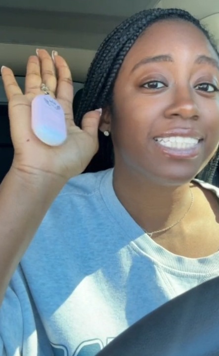 A Founding Queen holding the alarm in her car