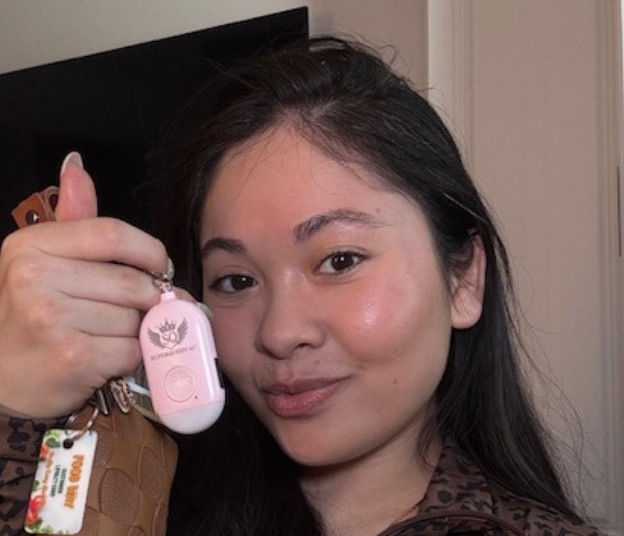 Cassidy Koon with the alarm clipped to her keys and bag